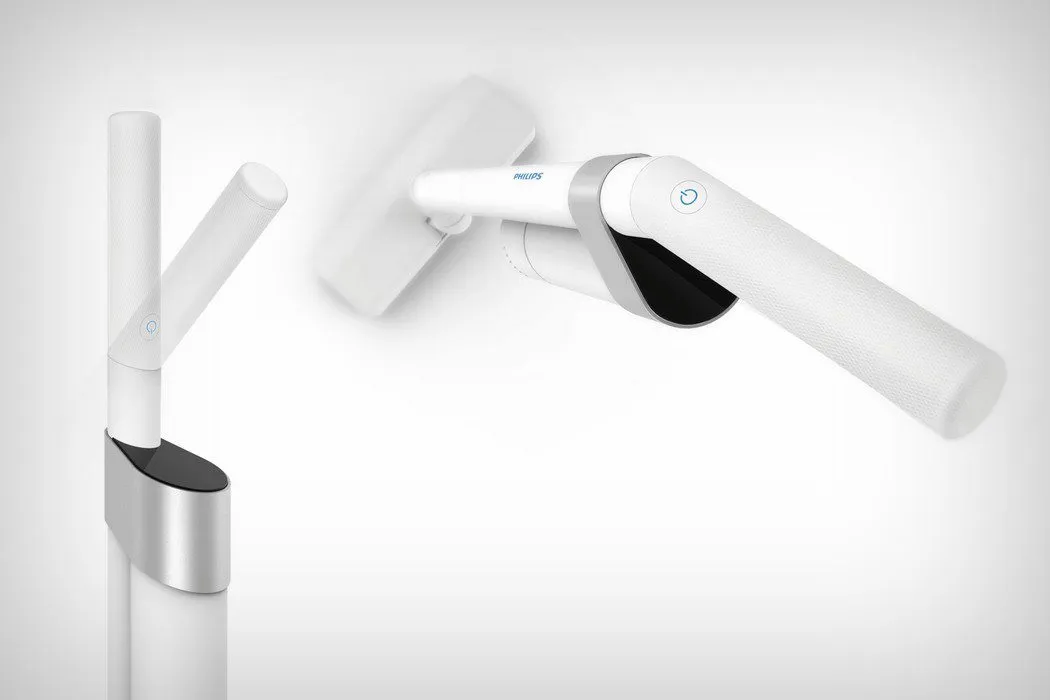 The block and the handheld: power button on the grip, display set into the angled face.