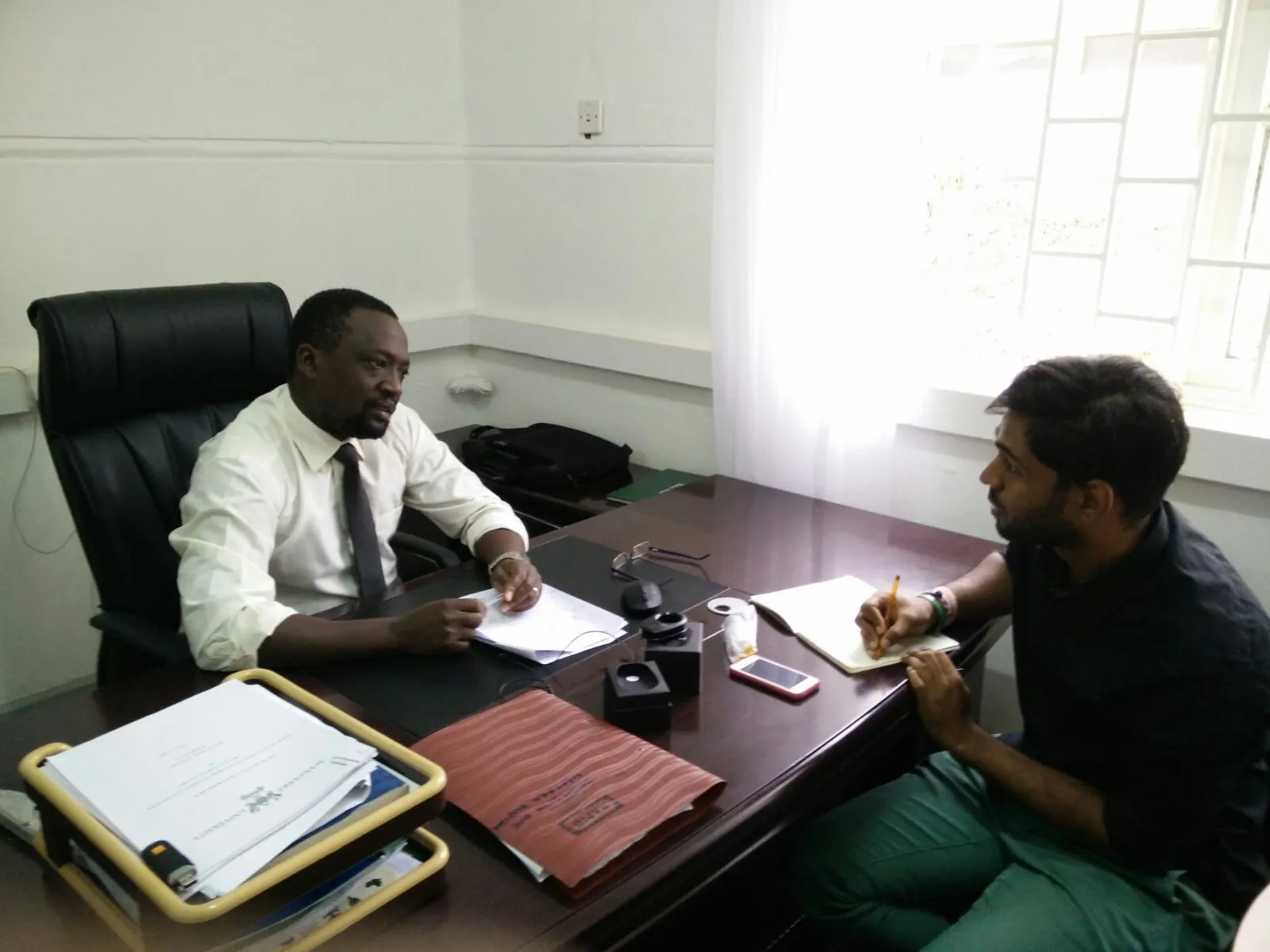 Interviewing a health centre in charge about what he can and cannot diagnose before referring a patient onward.