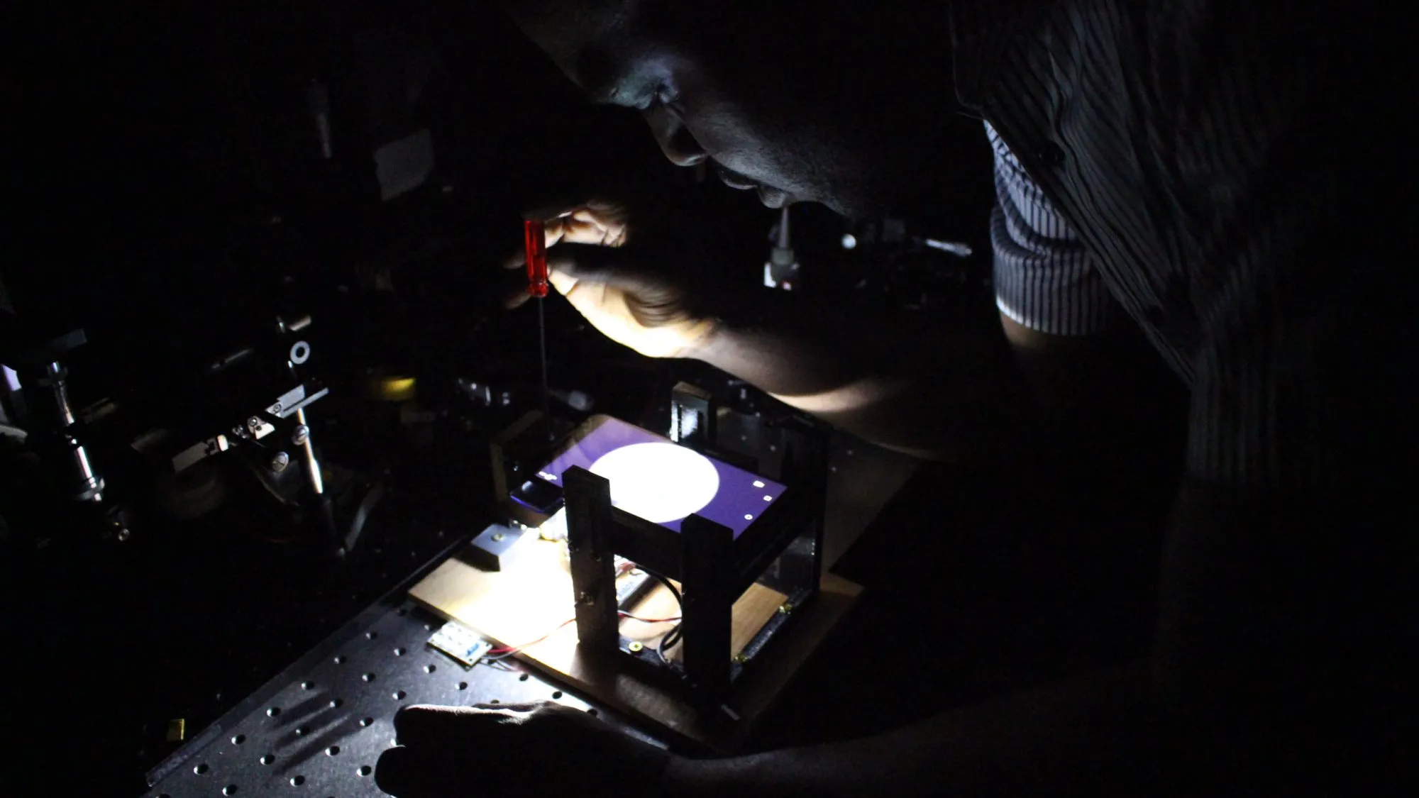 Aligning the illumination on the bench. Most of this work happened with the lights off.