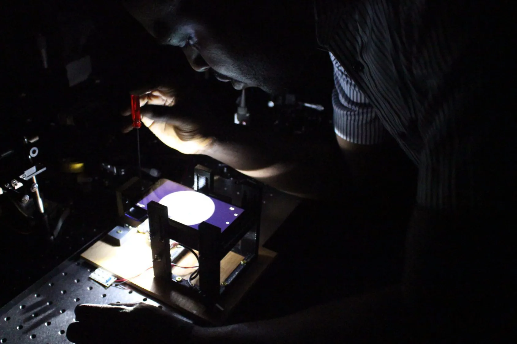 Aligning the illumination on the bench. Most of this work happened with the lights off.