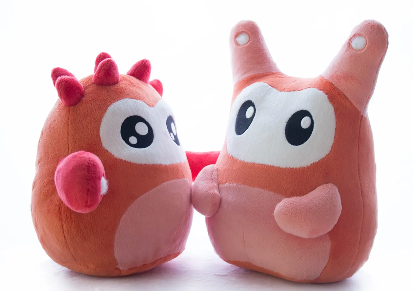The two finished production plushes