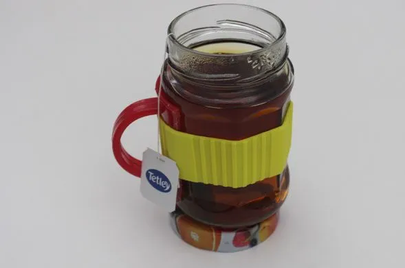 The prototype filled with black tea, a Tetley tag hanging over the band