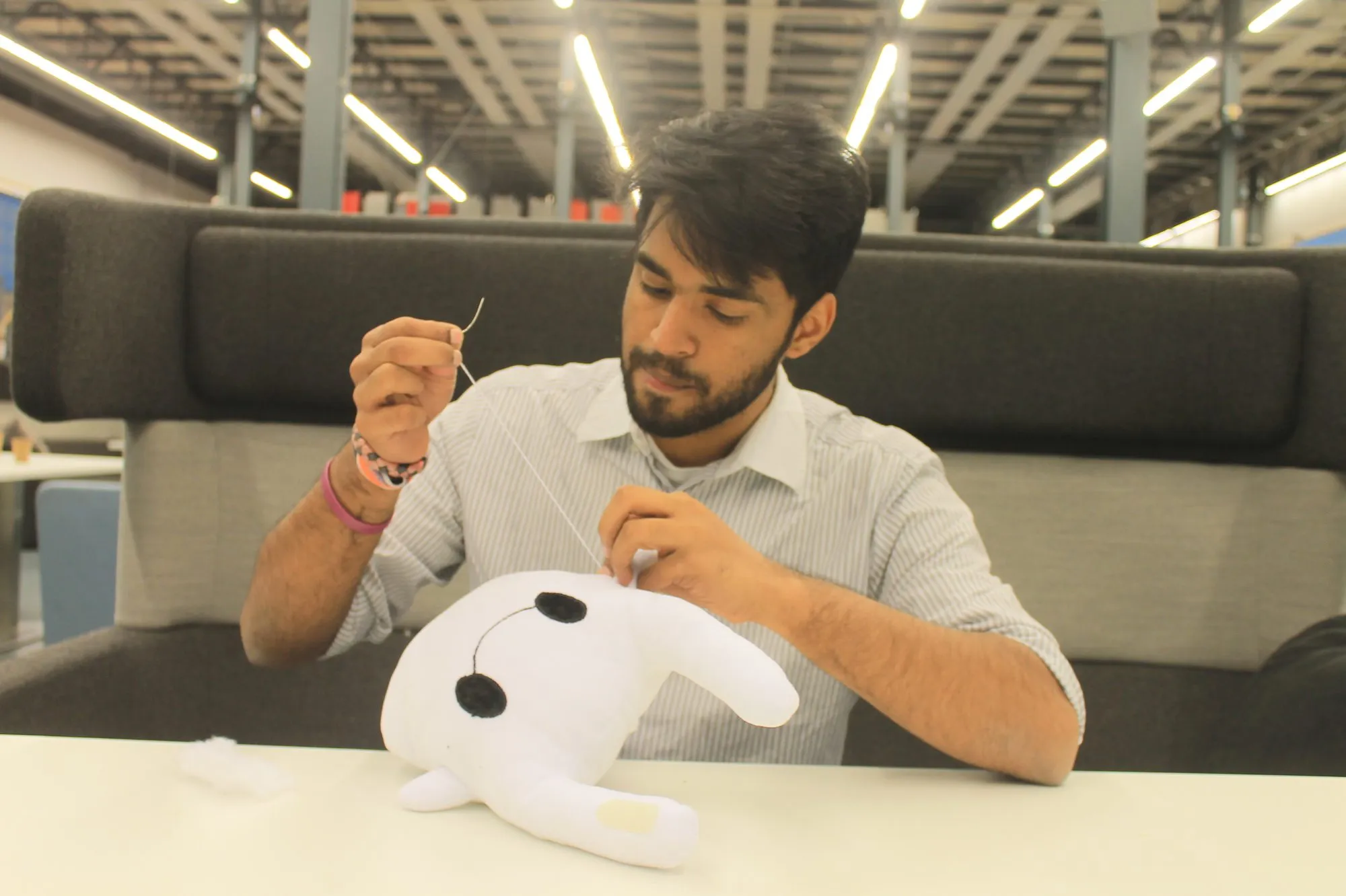 Stitching one of the first plush prototypes by hand