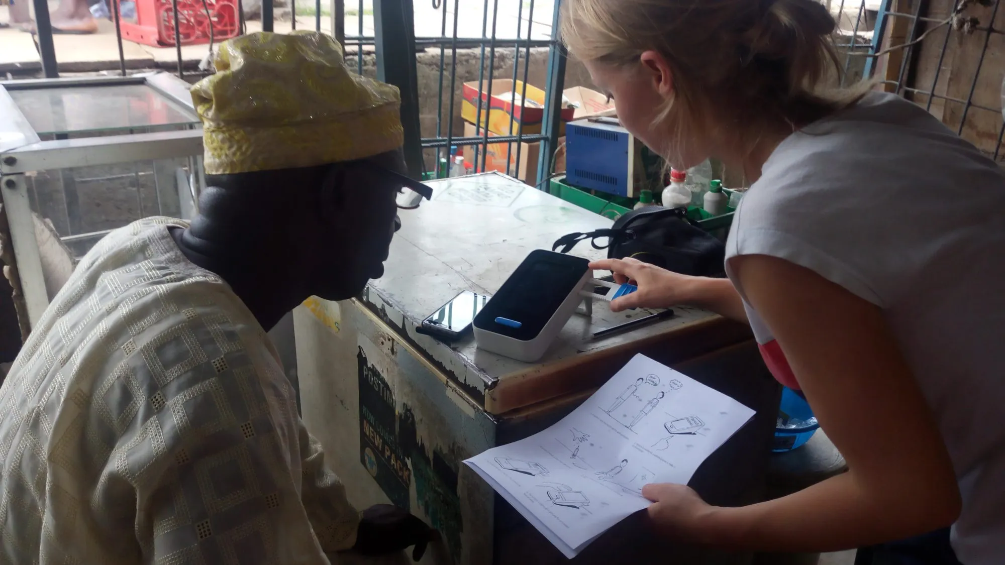 Walking a shopkeeper through the device with the illustrated instructions.