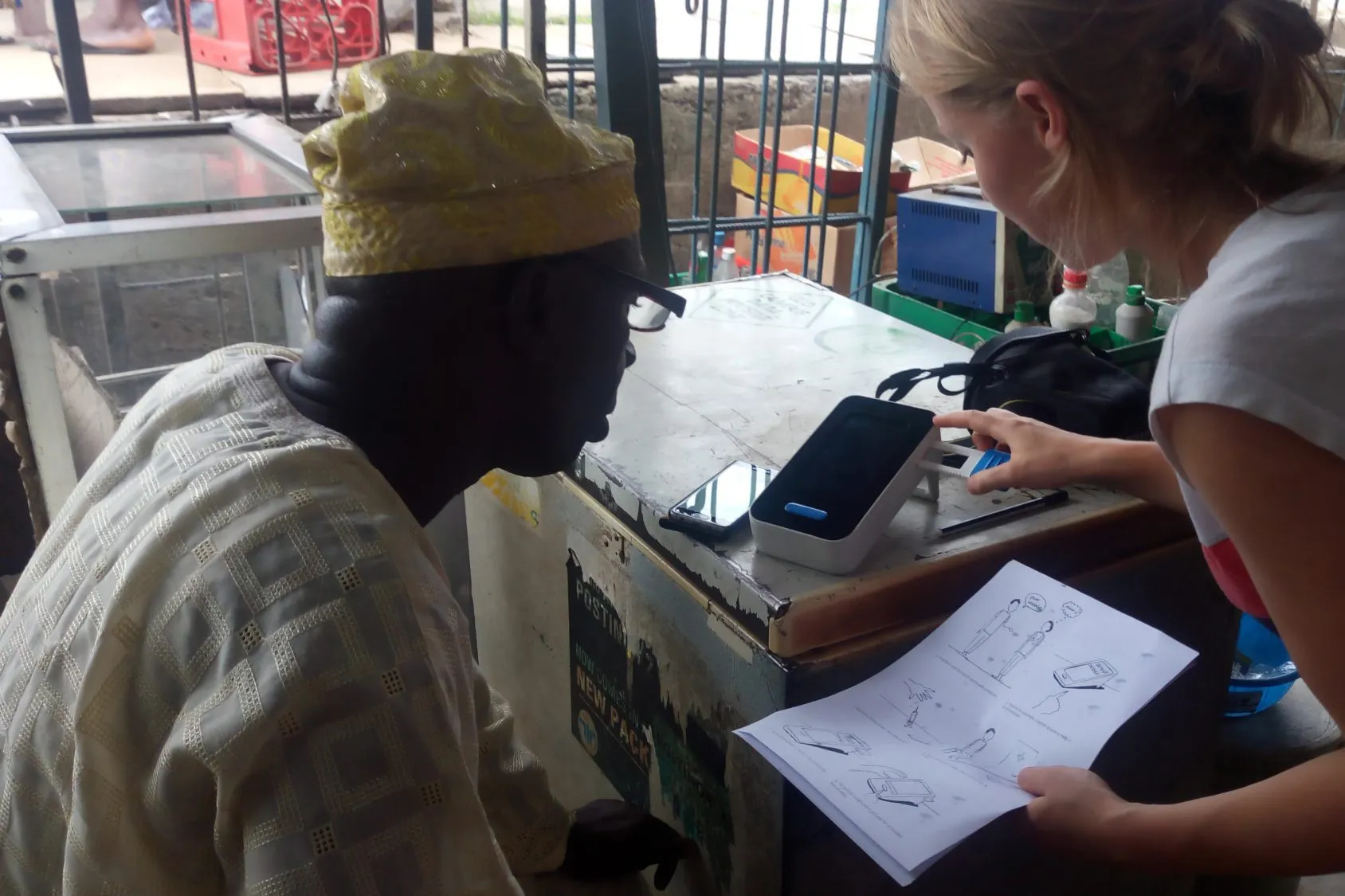 Walking a shopkeeper through the device with the illustrated instructions.