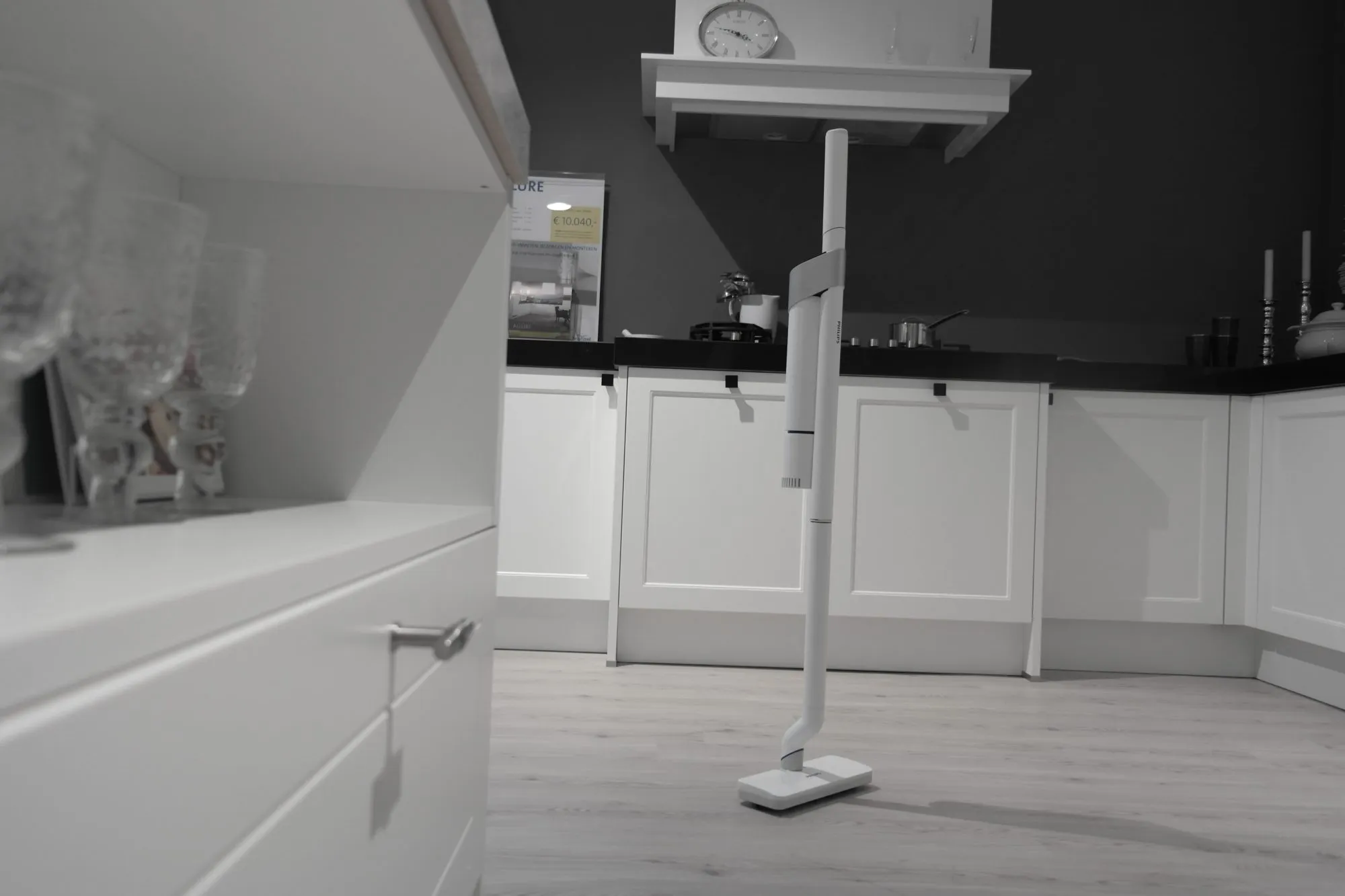 Standing on its own nozzle in a kitchen.